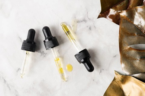 Flat lay different pipettes marble background