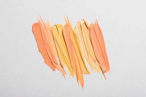 Flat lay yellow paint brush strokes