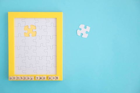 Missing white jigsaw puzzle frame blue background
