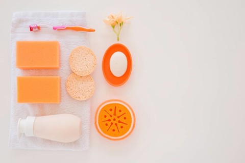 Orange personal care products white towel