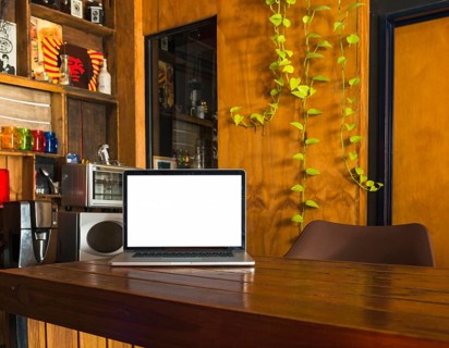 White blank screen laptop dining table home