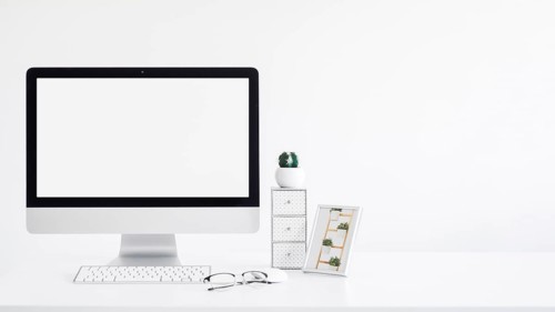 Keyboard near monitor frame cactus eyeglasses table