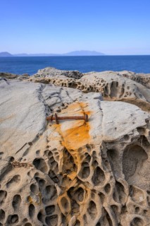 Rusty screw and stone structures in the Buca delle Fate