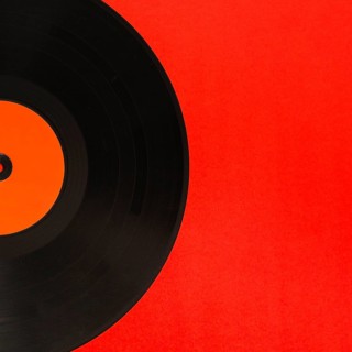 Close up vinyl record red background