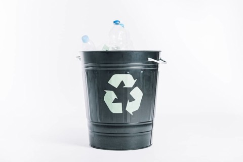 Recycle bucket with plastic bottles white background