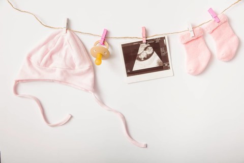 Sonography headwear pacifier sock hanging clothesline white backdrop
