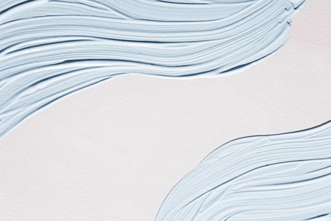 Flat lay pastel paint brush strokes surface