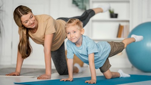 Full shot woman kid exercising together