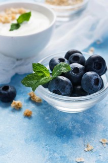 Small blueberries transparent bowl
