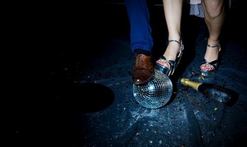 Couple standing floor with disco ball