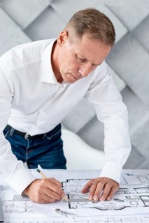 Architect working complex plan