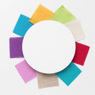 Colorful pieces cloths arrangement with white circle centered