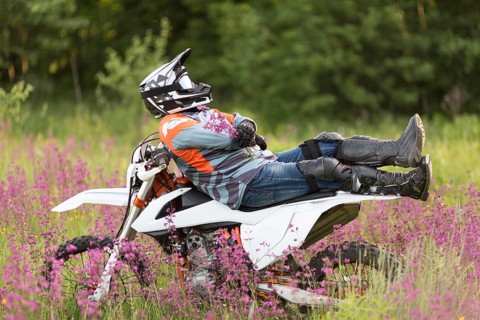 Stylish man relaxing top motorbike