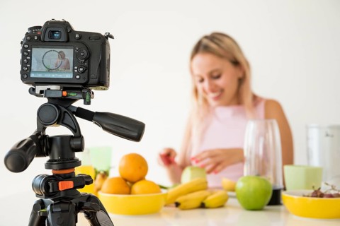 Blonde influencer recording nutrition food