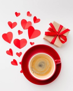 Flat lay cup coffee with valentines day present