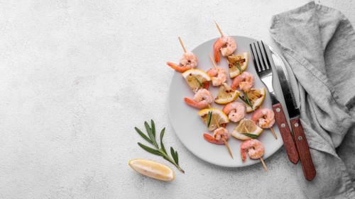 Fresh seafood shrimp skewers cutlery