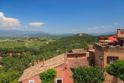 View over the houses of Roussillon into the landscape of the Luberon