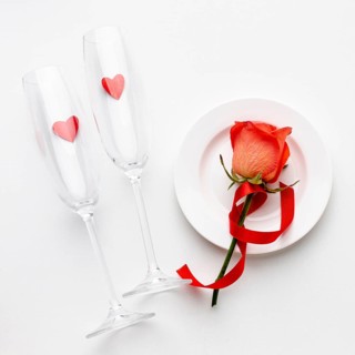 Arrangement with champagne glasses white background