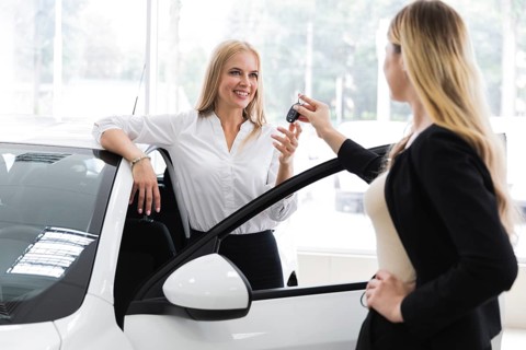 Dealer handing car key