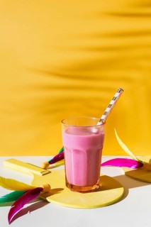 Delicious smoothie glass with straw
