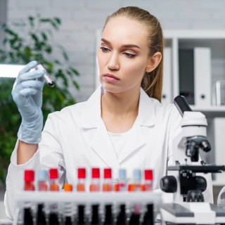 Front view female researcher laboratory with test tubes