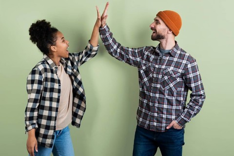 Couple posing while high fiving
