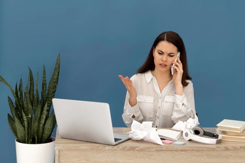 Stressed woman working laptop