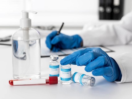 Close up doctor counting covid vaccines