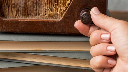Close up person using vintage radio button