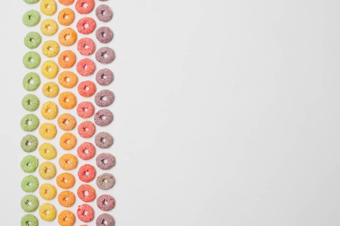 Flat lay frame with colorful cereals copy space