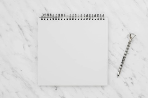 Top view white notebook marble desk