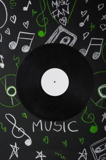 Vinyl record blackboard with drawn musical notes