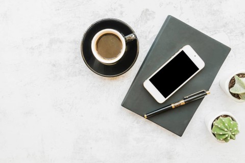 Smartphone coffee table with notebook