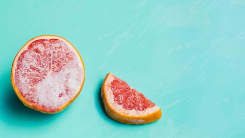 Frozen grapefruit turquoise background