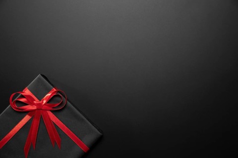 Wrapped black gift with copy space