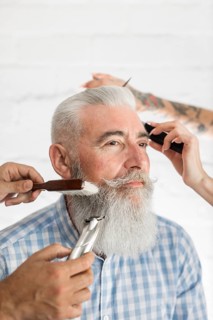 Senior customer getting beard hair care