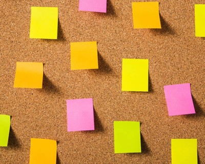 Colorful blank sticky notes cork board