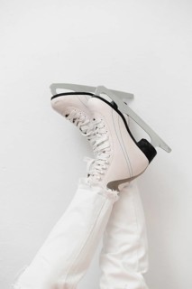 Woman wearing white ice skates