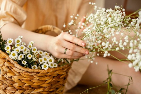 Woman with basket spring flowers