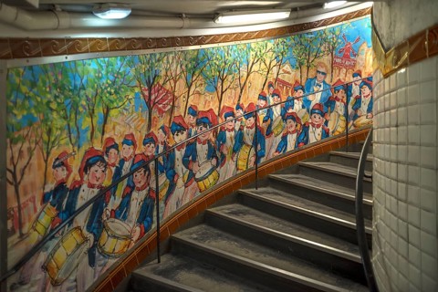 Staircase in the Metro station Abbesses decorated with a painting