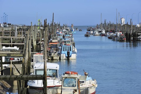 Fishing boats and oyster farming boats in the harbour Port du Bec near Beauvoir-sur-mer