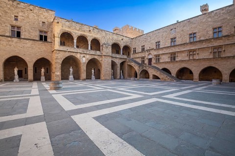 Inner courtyard surrounded by arcades with statues from Hellenistic and Roman times