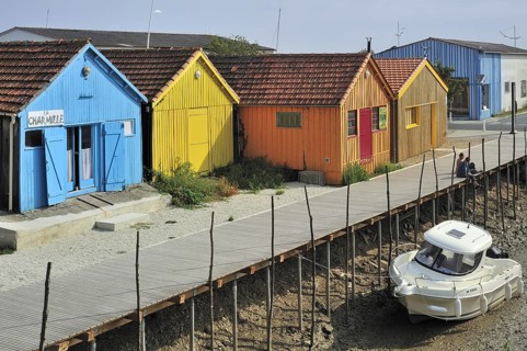 Colourful cabins of oyster farmers in the harbour at Le Chateau-d'Oleron on the island Ile d'Oleron