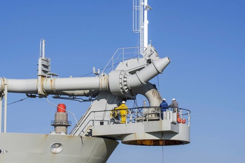 Workers on bow connection platform of trailing suction hopper dredger Alexander von Humboldt from Dredging and Marine Works Jan De Nul