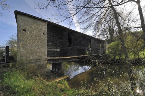 Wooden covered bridge over the river Bouzanne at Le Pont-Chretien-Chabenet