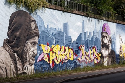 Homeless man and Karl Marx in juxtaposition