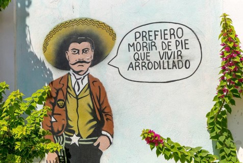Prefiero morir de pie que vivir arrodillado I'd rather die standing than live kneeling