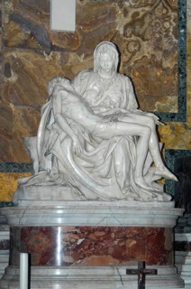 Frontal view of marble sculpture Sculpture in white marble from Carrara Pieta by Michelangelo Mary Mother of God mourns holds son