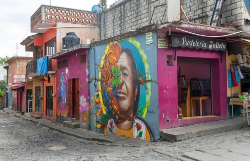 Mural painted on wall pf pasteleria shop on corner of street Tepoztlan