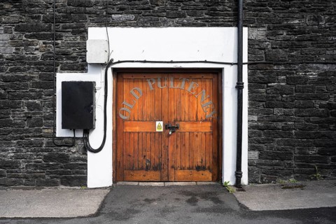 Wooden door to the warehouse of the Old Pulteney whisky distillery in Wick